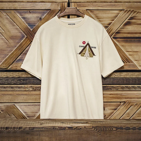 Beige t-shirt with a logo on a wooden background